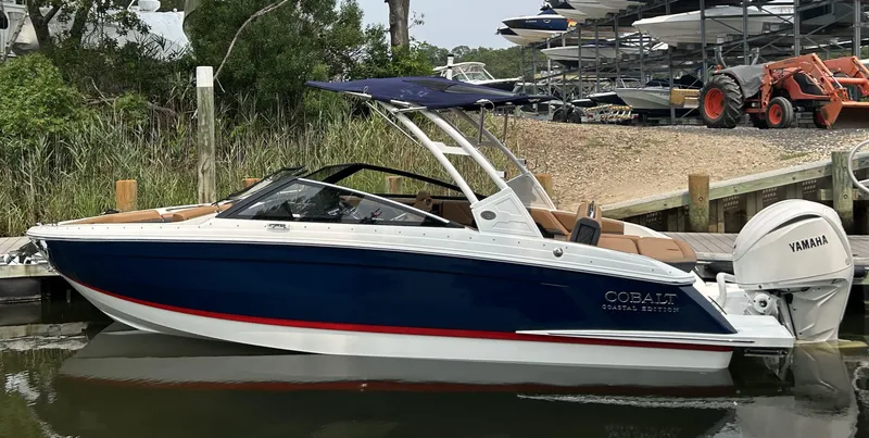 The Image of 2026 Cobalt R4 Outboard boat docked, featuring sleek design and Yamaha engine. - 0