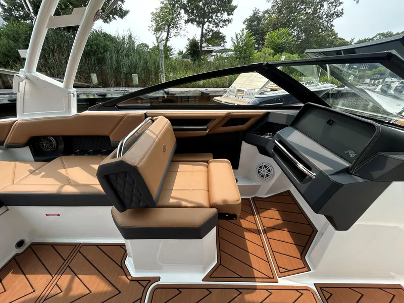 Slide: The Image of 2026 Cobalt R4 Outboard interior with tan seating and sleek dashboard design. - 14