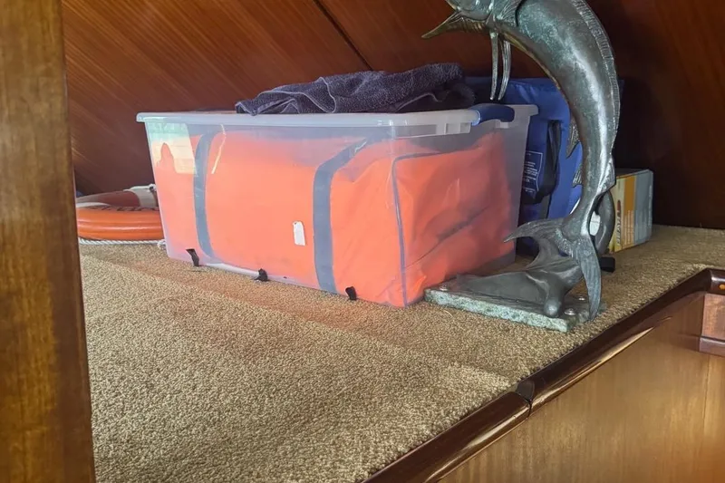 Slide: The Image of Storage area on 1970 Hatteras 45 Convertible with plastic bin and marlin sculpture. - 14