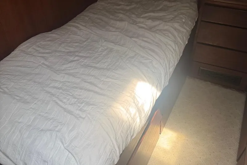 Slide: The Image of Cozy cabin bed inside a 1970 Hatteras 45 Convertible yacht. - 20