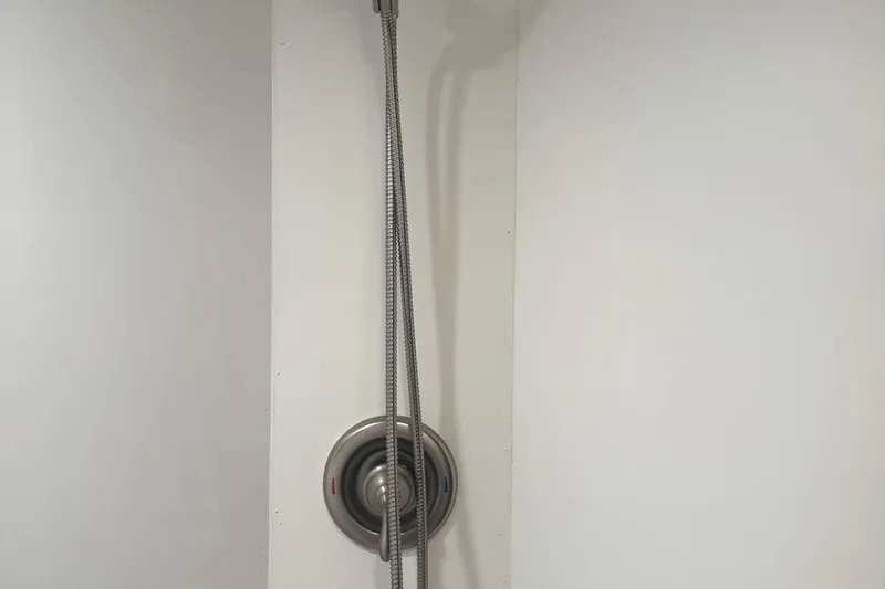 Slide: The Image of Shower fixture in a 1970 Hatteras 45 Convertible boat bathroom. - 25