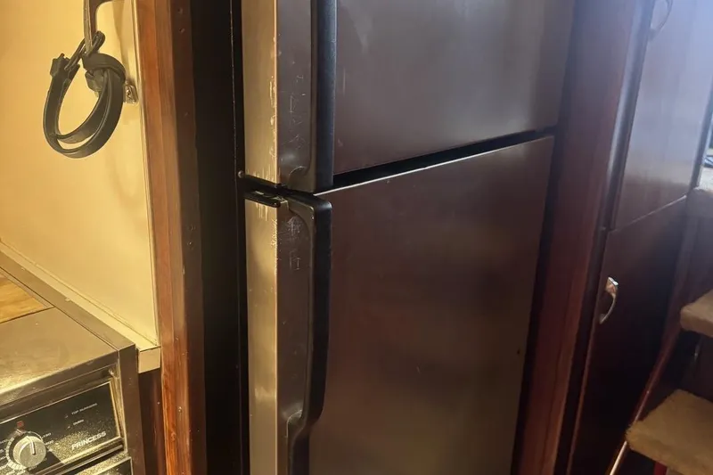 Slide: The Image of Stainless steel refrigerator in 1970 Hatteras 45 Convertible yacht kitchen. - 27