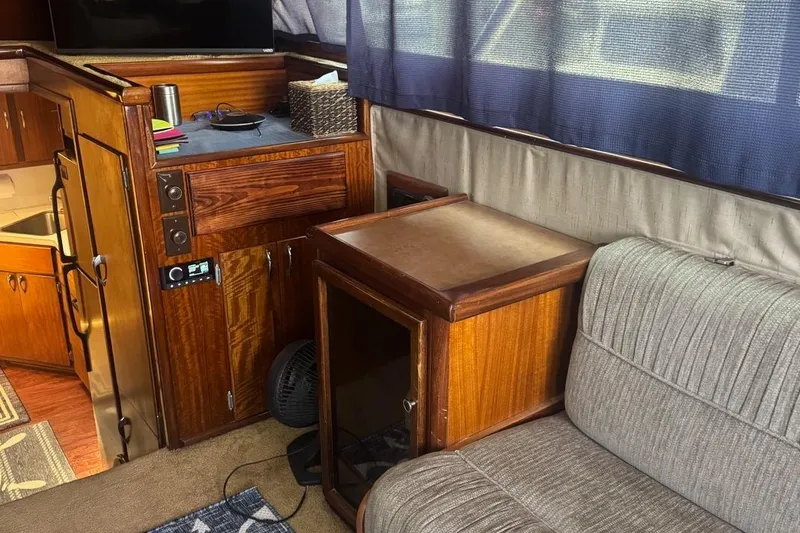 Slide: The Image of Interior of 1970 Hatteras 45 Convertible yacht with wood cabinetry and seating. - 32