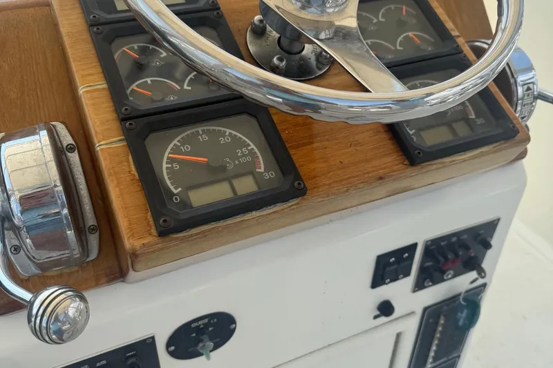 Slide: The Image of Steering wheel and gauges of 1970 Hatteras 45 Convertible boat. - 33
