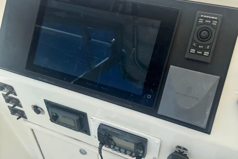 Slide: The Image of Control panel of a 1970 Hatteras 45 Convertible boat with navigation equipment. - 34