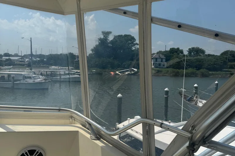 Slide: The Image of View from 1970 Hatteras 45 Convertible boat, overlooking marina and waterfront scenery. - 5