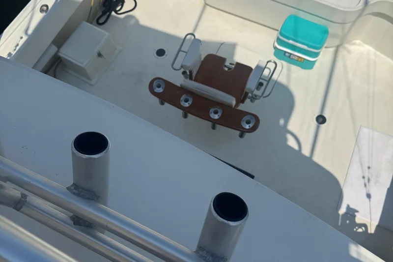 Slide: The Image of 1970 Hatteras 45 Convertible boat deck with fishing chair and cooler. - 7