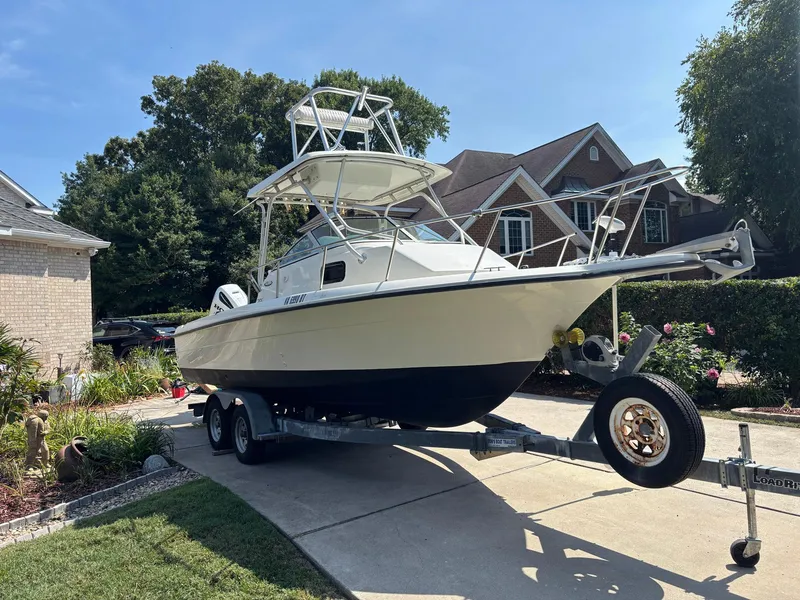 Slide: The Image of 2000 Hydra-Sports 230 Seahorse WA boat on trailer in residential driveway. - 1