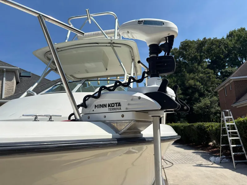 Slide: The Image of 2000 Hydra-Sports 230 Seahorse WA with Minn Kota Terrova motor, parked outdoors. - 10