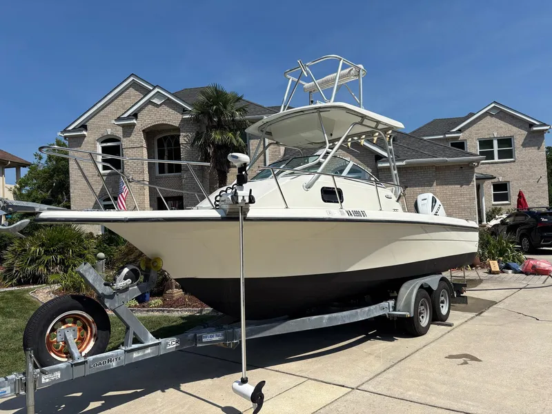 Slide: The Image of 2000 Hydra-Sports 230 Seahorse WA boat on trailer in residential driveway. - 2