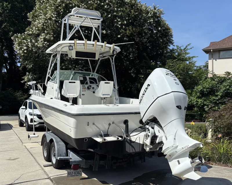 Slide: The Image of 2000 Hydra-Sports 230 Seahorse WA boat with Honda outboard motor on trailer. - 4