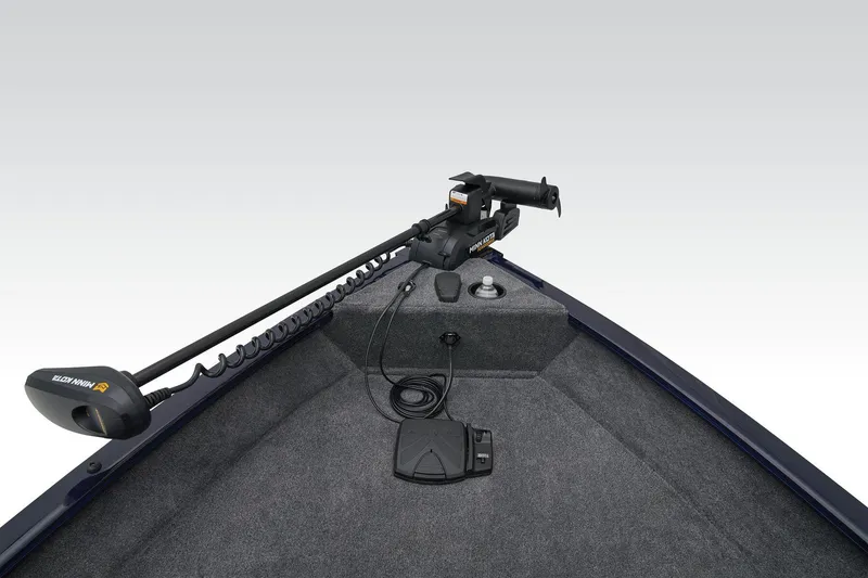 Slide: The Image of Manufacturer Provided Image: 2026 Tracker Pro Guide V-16 SC boat interior with trolling motor and carpeted deck. - 13