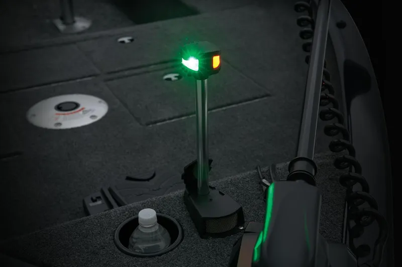 Slide: The Image of Manufacturer Provided Image: 2026 Tracker Pro Guide V-16 SC boat interior with navigation light and cup holder. - 15