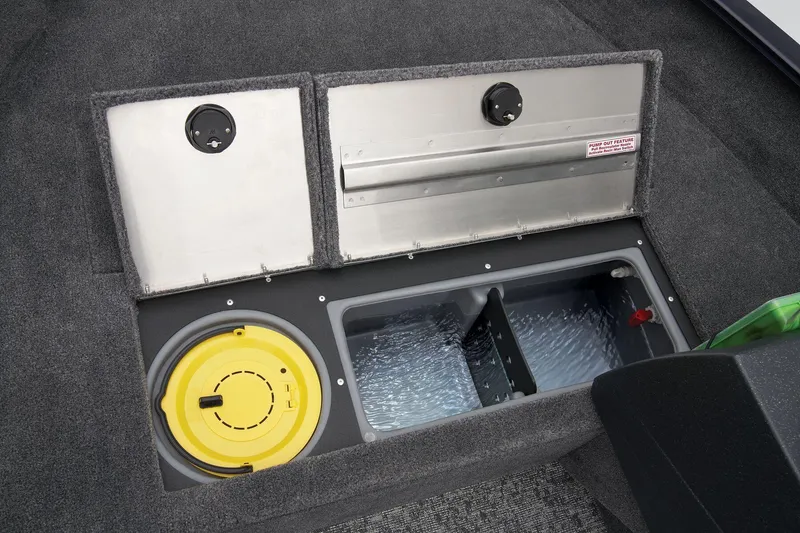 Slide: The Image of Manufacturer Provided Image: 2026 Tracker Pro Guide V-16 SC boat storage compartments with yellow lid and metal covers. - 18