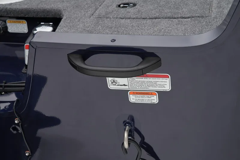 Slide: The Image of Manufacturer Provided Image: 2026 Tracker Pro Guide V-16 SC boat handle and warning labels close-up. - 48