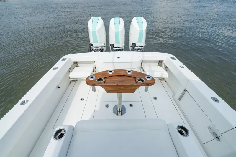 Slide: The Image of 2024 Valhalla Boatworks V-37 cockpit with triple engines and sleek design. - 13
