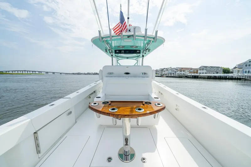 Slide: The Image of 2024 Valhalla Boatworks V-37 on water, featuring sleek design and American flag. - 14