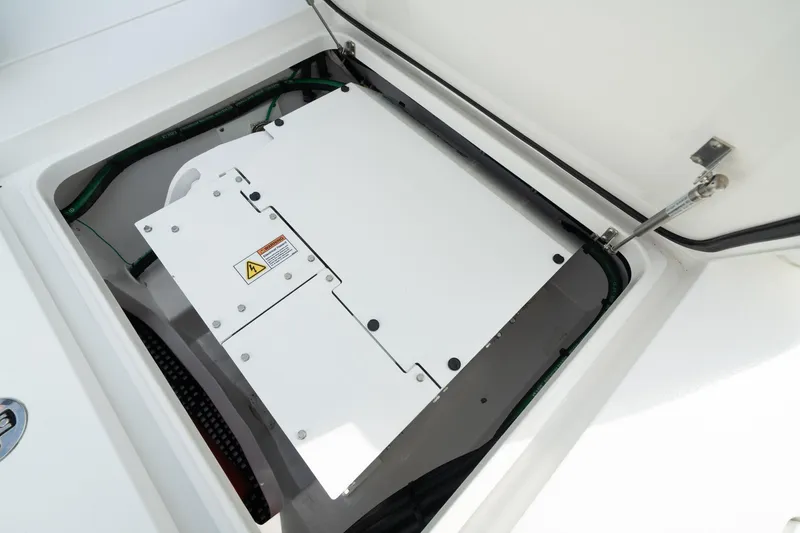 Slide: The Image of 2024 Valhalla Boatworks V-37 electrical compartment with safety warning label. - 15