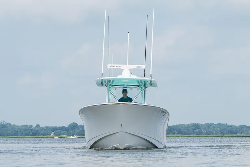 Slide: The Image of 2024 Valhalla Boatworks V-37 cruising on calm waters under a cloudy sky. - 6