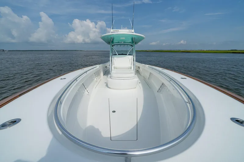 Slide: The Image of 2024 Valhalla Boatworks V-37 on water, showcasing sleek design and spacious deck. - 8