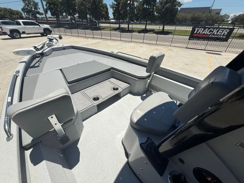 Slide: The Image of 2022 Avid 23 Fusion Platinum boat interior with seating and storage compartments. - 10