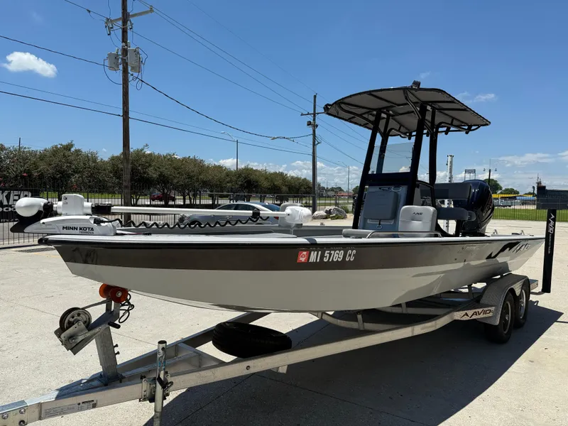 Slide: The Image of 2022 Avid 23 Fusion Platinum boat on trailer, featuring Minn Kota trolling motor. - 3