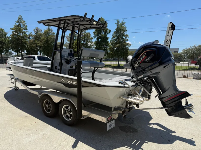 Slide: The Image of 2022 Avid 23 Fusion Platinum boat on trailer with Yamaha outboard motor. - 4