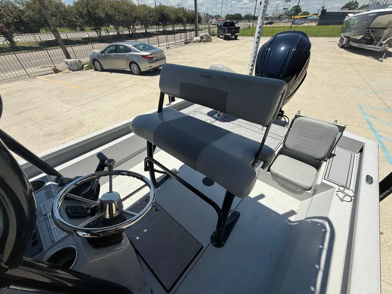 Slide: The Image of 2022 Avid 23 Fusion Platinum boat interior with steering wheel and seating. - 9
