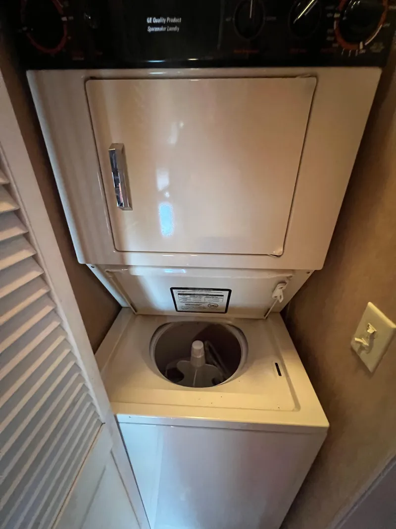 Slide: The Image of Stacked washer and dryer unit inside a 1993 Sumerset houseboat. - 13