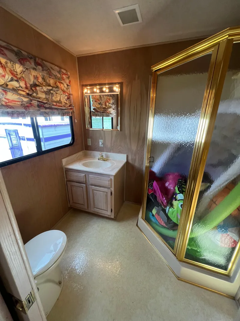 Slide: The Image of Bathroom interior of a 1993 Sumerset houseboat with shower, sink, and toilet. - 26