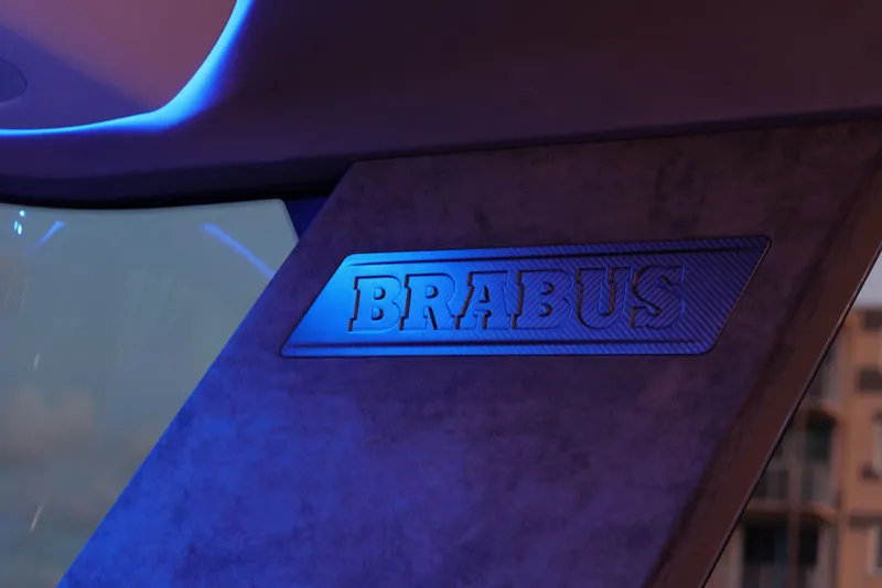 Slide: The Image of Interior detail of 2026 BRABUS 1500 with illuminated logo and modern design. - 11