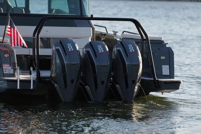 Slide: The Image of 2026 BRABUS 1500 boat with triple 500R engines on water, American flag displayed. - 12