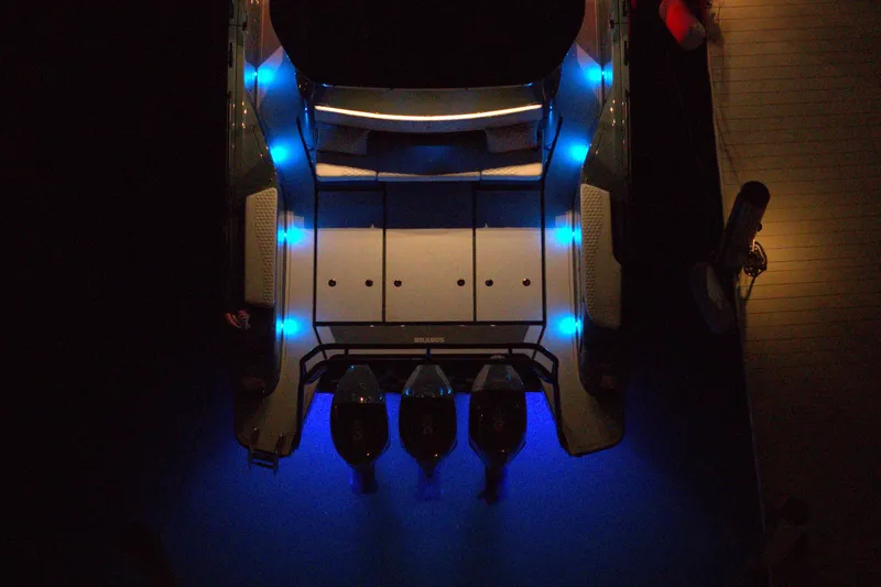 Slide: The Image of Aerial view of 2026 BRABUS 1500 boat with blue LED lights at night. - 18