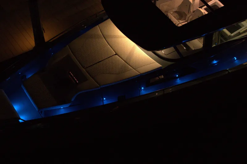 Slide: The Image of Luxurious 2026 BRABUS 1500 yacht interior with ambient blue lighting at night. - 15