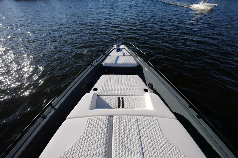 Slide: The Image of Luxurious 2026 BRABUS 1500 boat with white quilted seating on open water. - 6