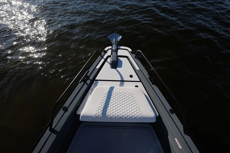 Slide: The Image of Bow of 2026 BRABUS 1500 boat with quilted seating, on shimmering water. - 8