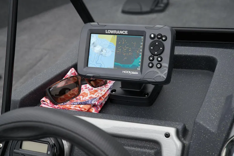 Slide: The Image of Manufacturer Provided Image: Lowrance fishfinder on 2026 Tracker Pro Guide V-175 WT boat dashboard with sunglasses and cloth. - 36
