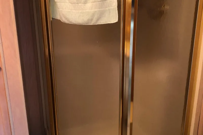 Slide: The Image of Shower with glass doors in 1997 Sumerset 75' X 16' houseboat. - 18