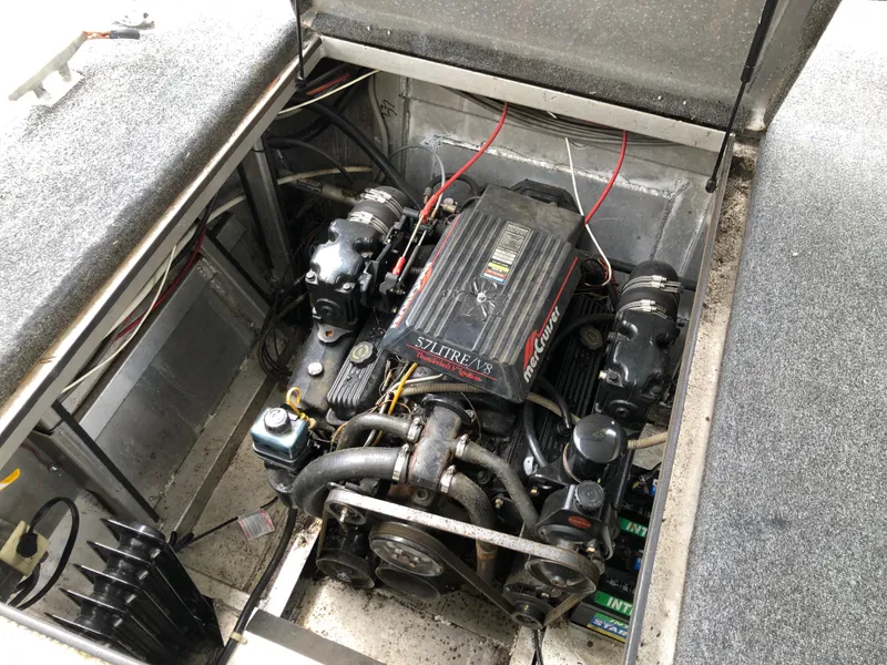 Slide: The Image of Engine compartment of a 1997 Sumerset 75' X 16' houseboat, featuring a MerCruiser V8 engine. - 23