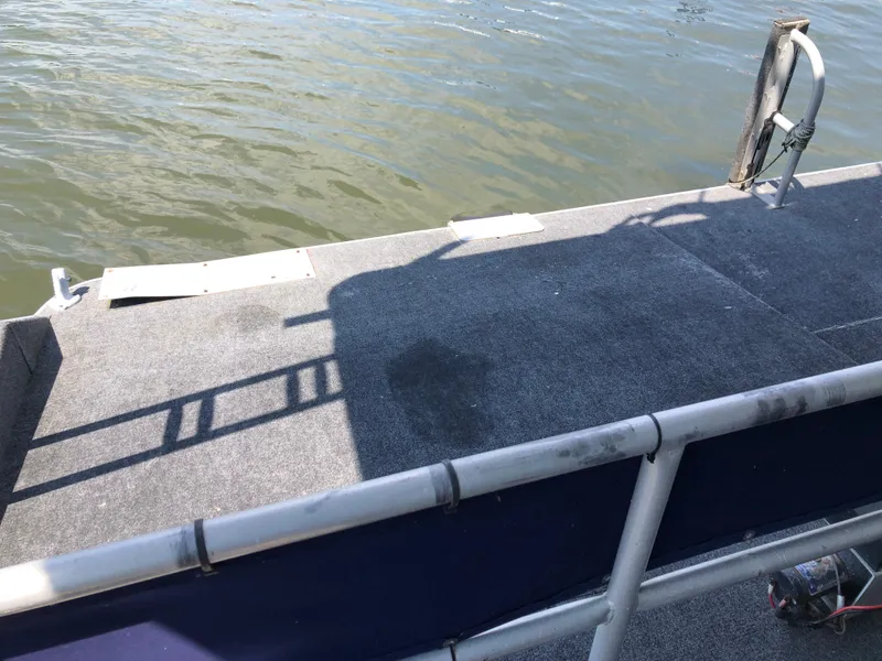 Slide: The Image of 1997 Sumerset 75' X 16' houseboat deck with water view and railing. - 32