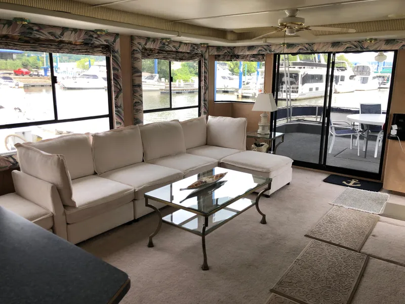 Slide: The Image of Luxurious 1997 Sumerset 75' X 16' houseboat interior with white sofa and glass table. - 7