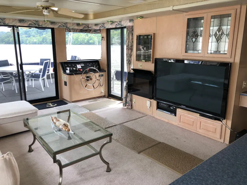 Slide: The Image of Luxurious 1997 Sumerset houseboat interior with modern living area and scenic views. - 8