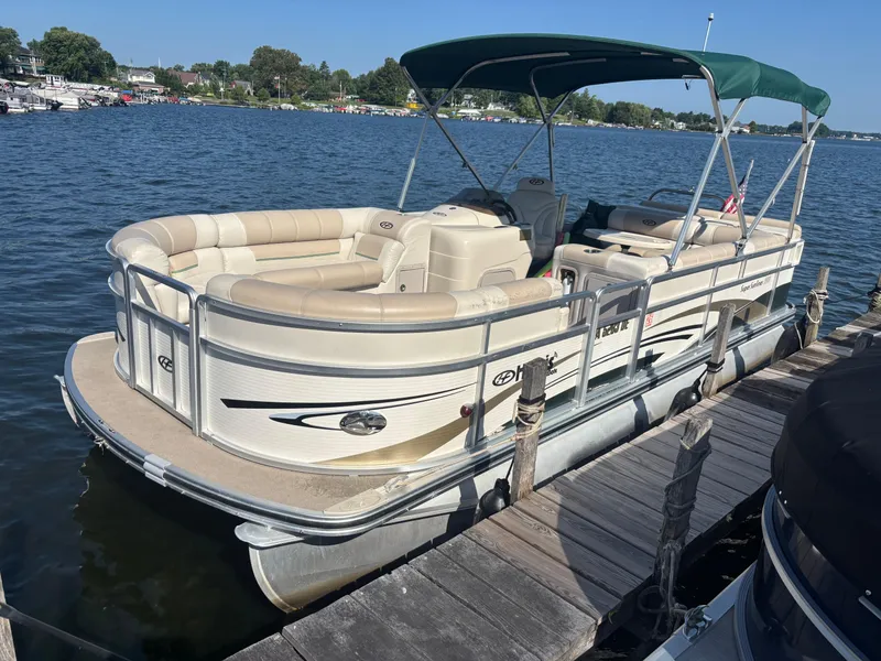 Slide: The Image of 2010 Harris FloteBote 200 Super Sunliner pontoon boat docked on a sunny lake. - 6