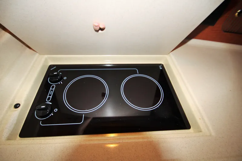 Slide: The Image of Stovetop in 2003 Sea Ray 320 Sundancer yacht kitchen area. - 11