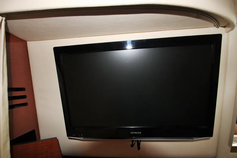 Slide: The Image of Hitachi TV mounted inside a 2003 Sea Ray 320 Sundancer yacht cabin. - 16