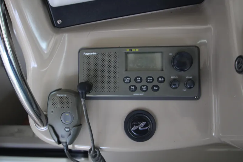 Slide: The Image of Raymarine radio system on 2003 Sea Ray 320 Sundancer boat dashboard. - 39