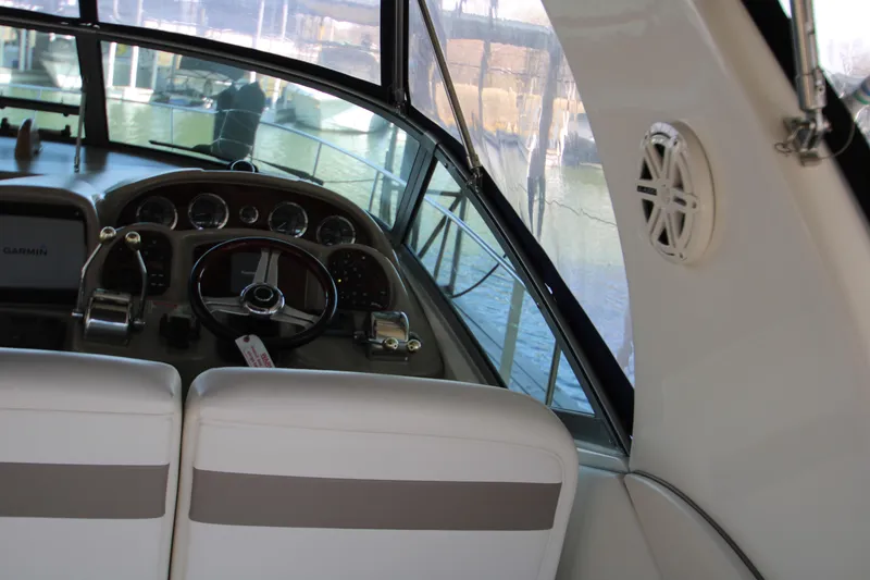 Slide: The Image of Interior view of 2003 Sea Ray 320 Sundancer boat cockpit with steering wheel and controls. - 41