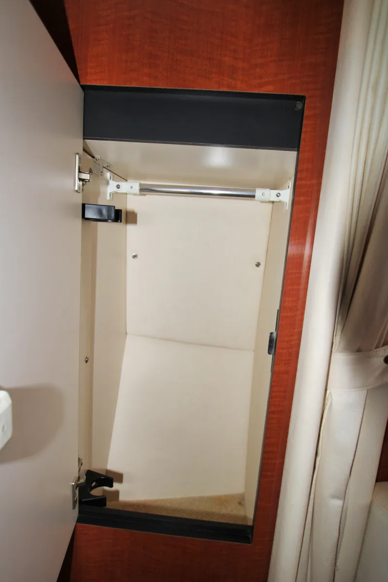 Slide: The Image of Open storage compartment inside 2003 Sea Ray 320 Sundancer boat. - 9