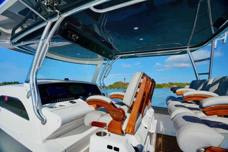 Slide: The Image of 2021 Valhalla Boatworks V46 interior with luxurious seating and advanced navigation system. - 13