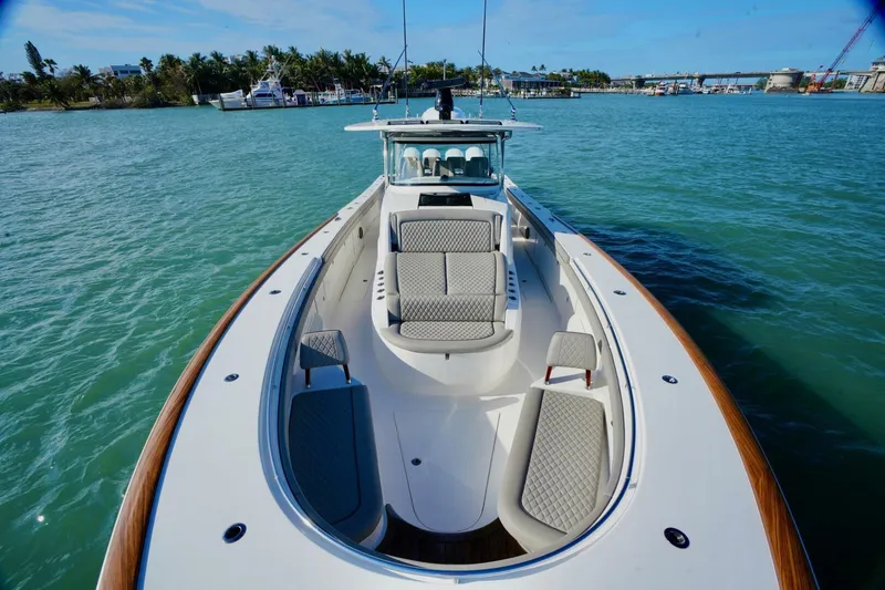 Slide: The Image of 2021 Valhalla Boatworks V46 on water, featuring spacious deck and luxurious seating. - 16